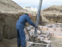 Alan pouring concrete