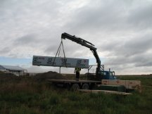 Subfloor arrives and is unloaded