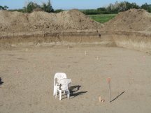 Laying out the house again in the bottom of the pit