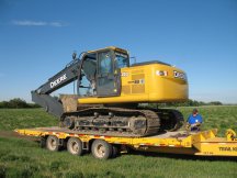 Jock unloads the trackhoe