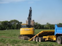 Jock unloads the trackhoe