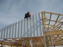 Securing a piece of siding to the rafters