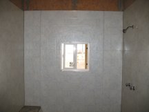 Working on the shower wall