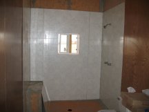 Working on the shower wall
