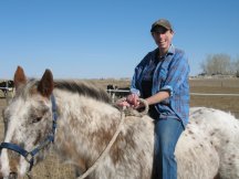Tracy plays with cows
