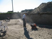 Tracy works the compactor
