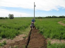 Tracy running the Ditch Witch