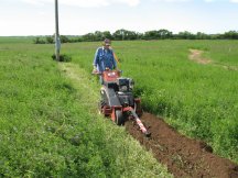 Tracy running the Ditch Witch