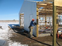 Tracy finishes up the west wall.